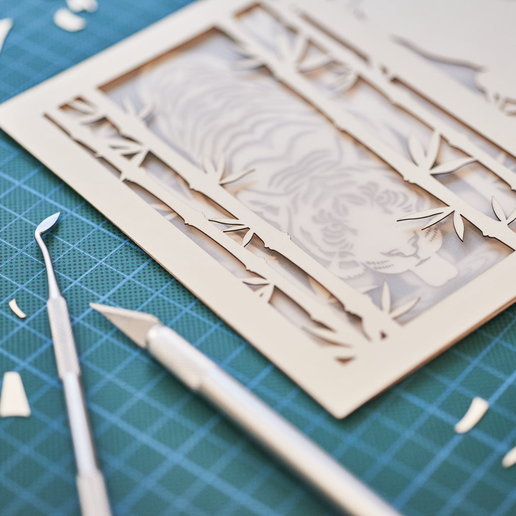Elegant tiger drinking water among bamboo in forest
