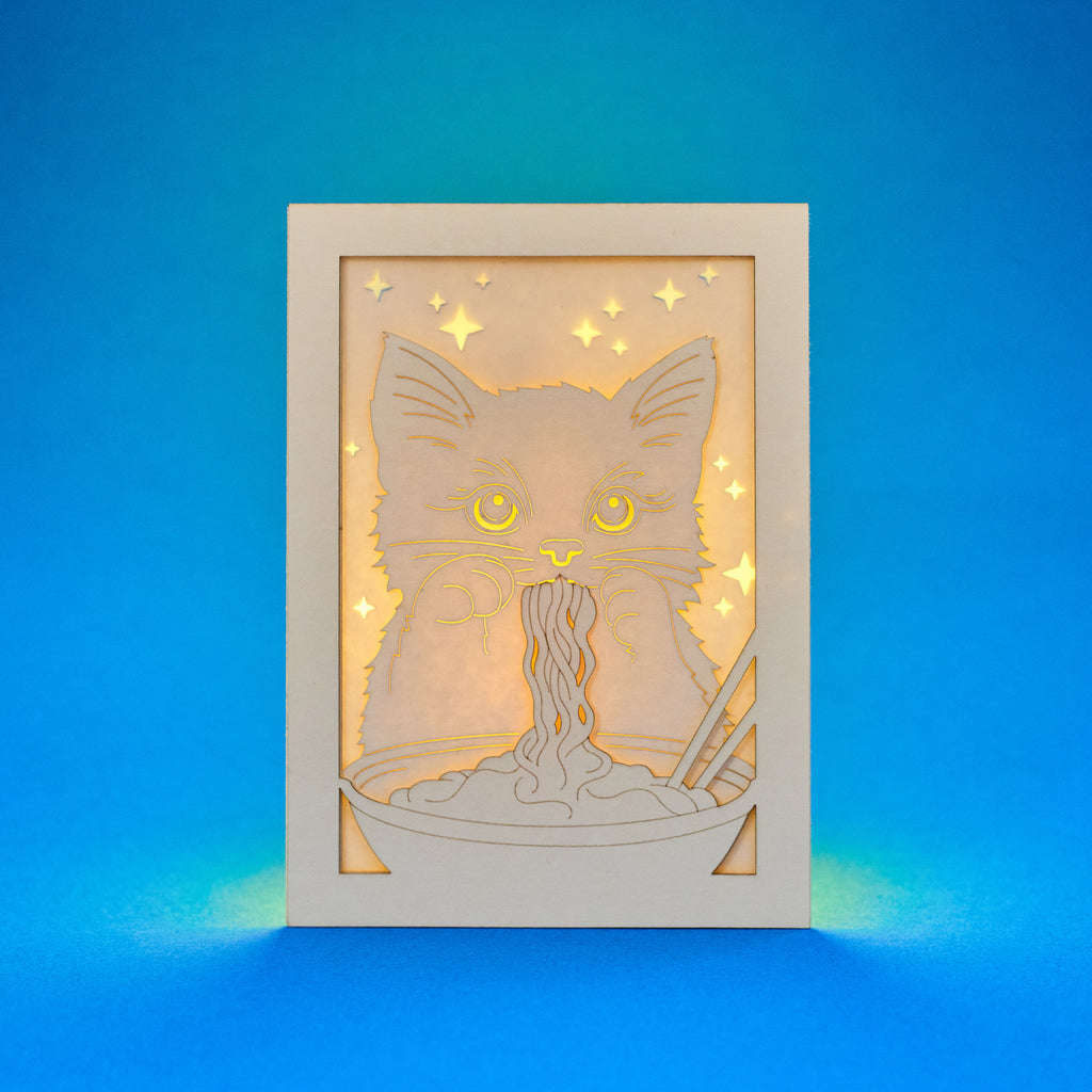 Adorable cat eating ramen noodles with chopsticks