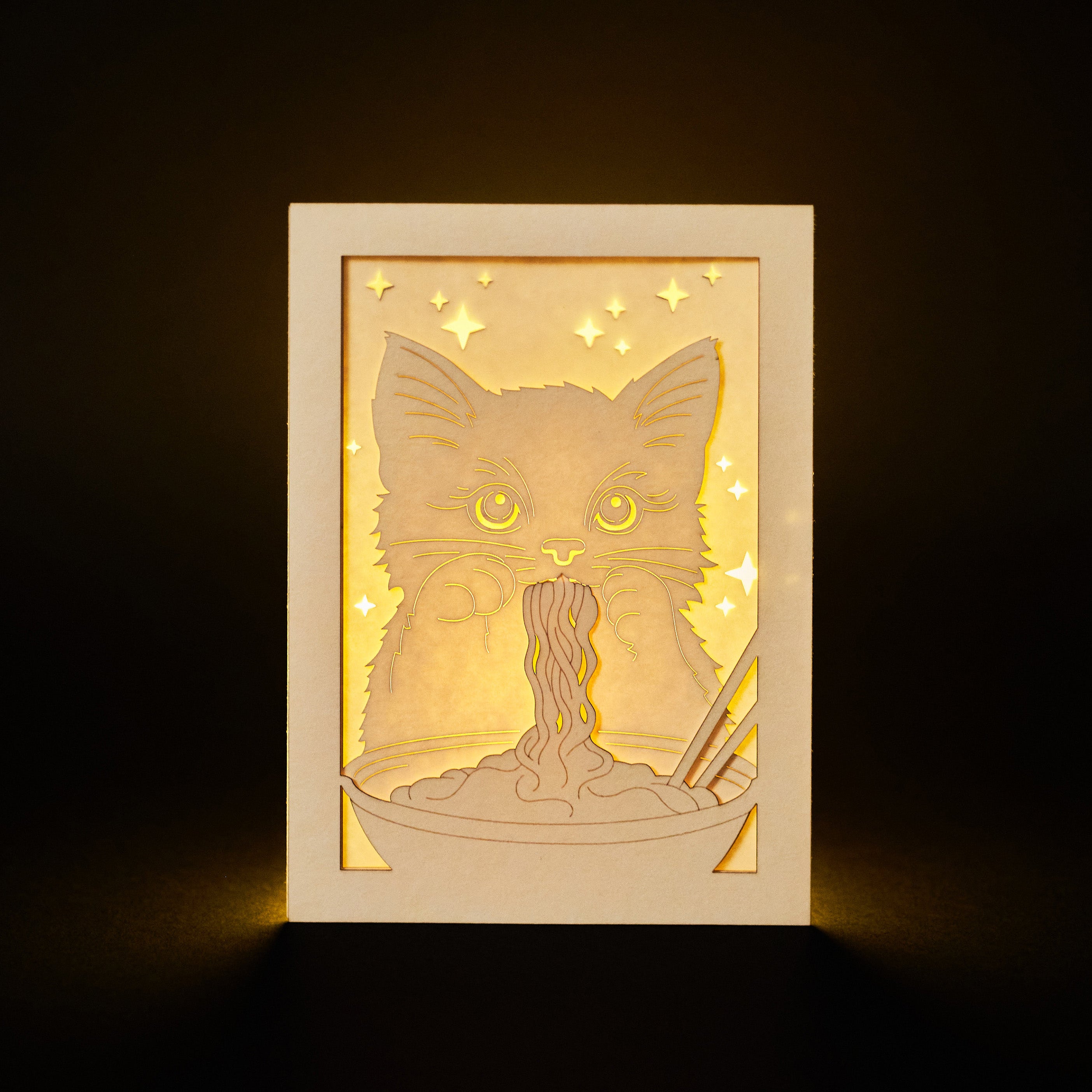 Adorable cat eating ramen noodles with chopsticks