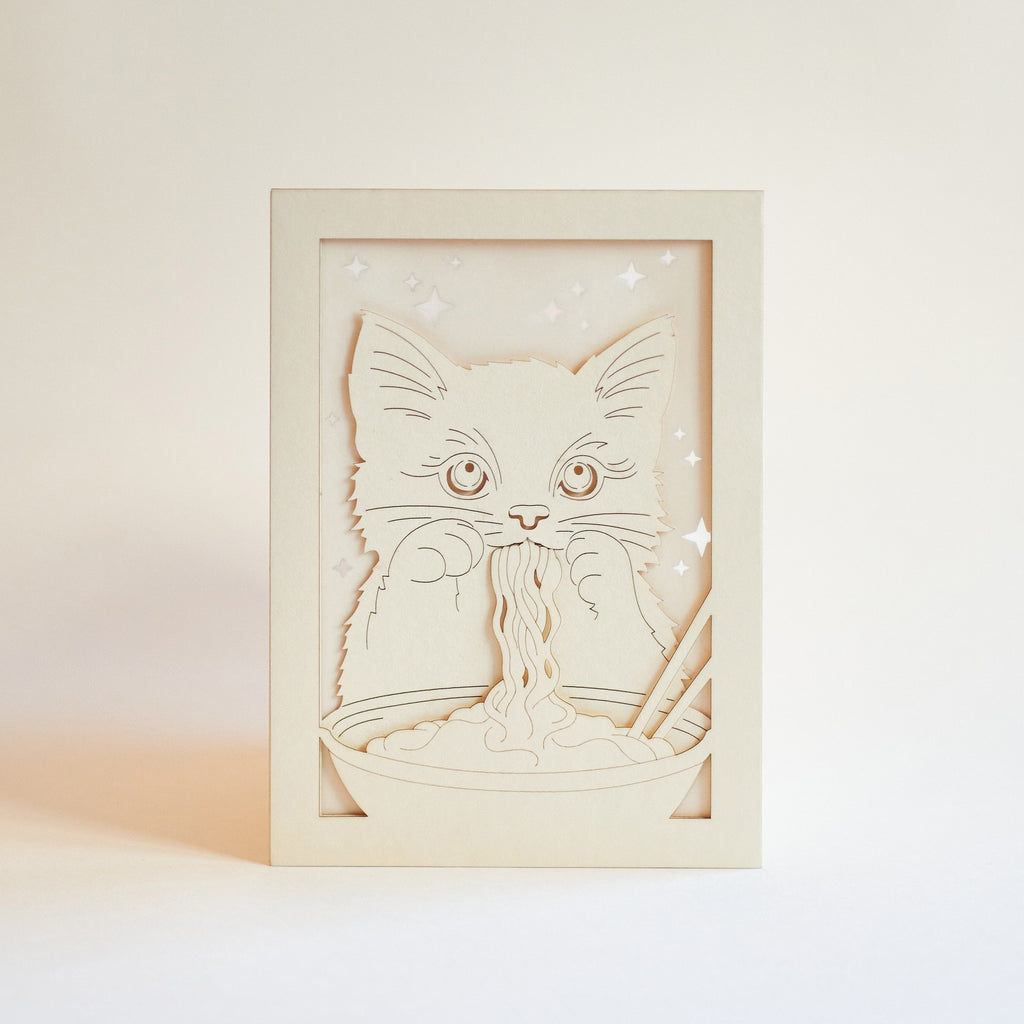 Adorable cat eating ramen noodles with chopsticks