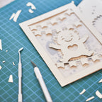 Cute hedgehog making snow angel with festive banner flags