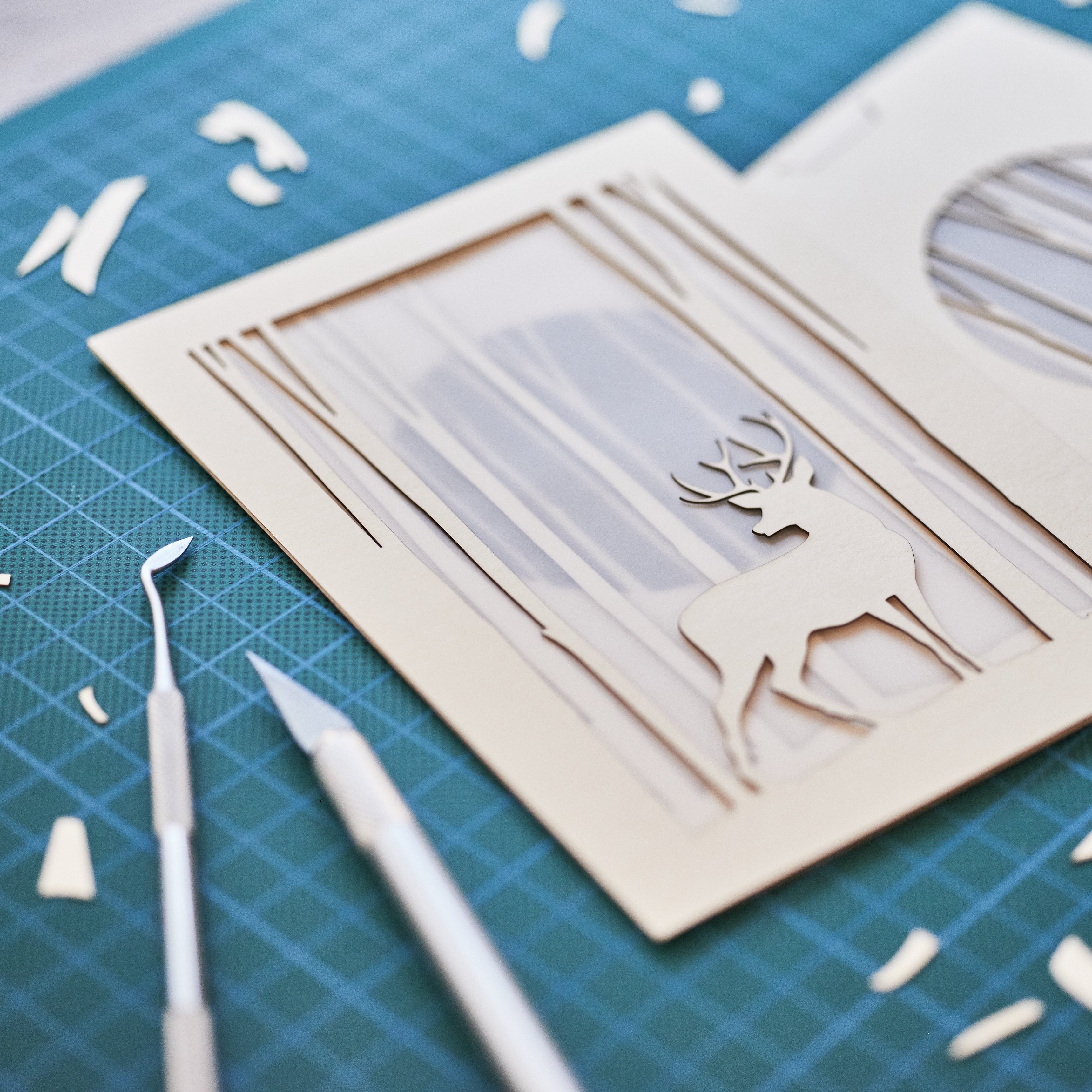 Graceful deer silhouette in winter forest with moon