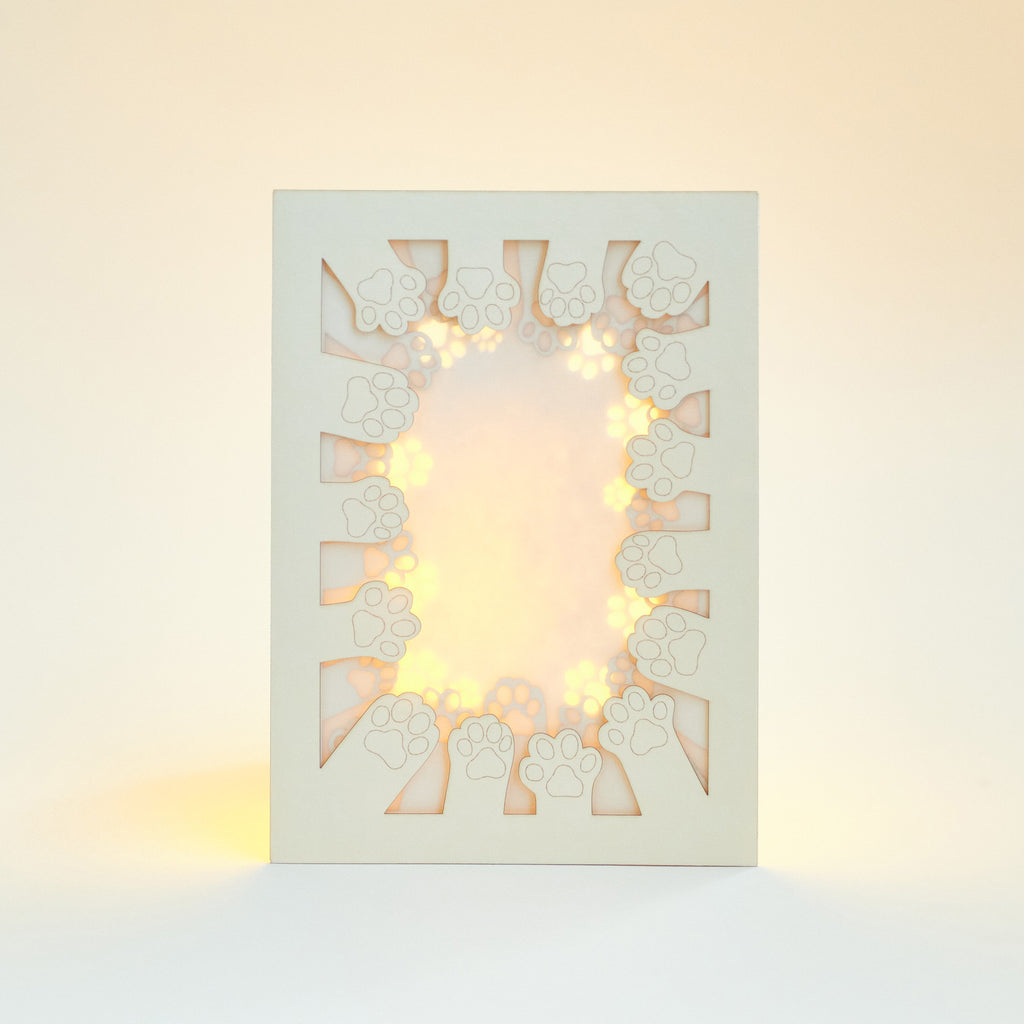 Circle of cat paws with plenty of space to add your wishes