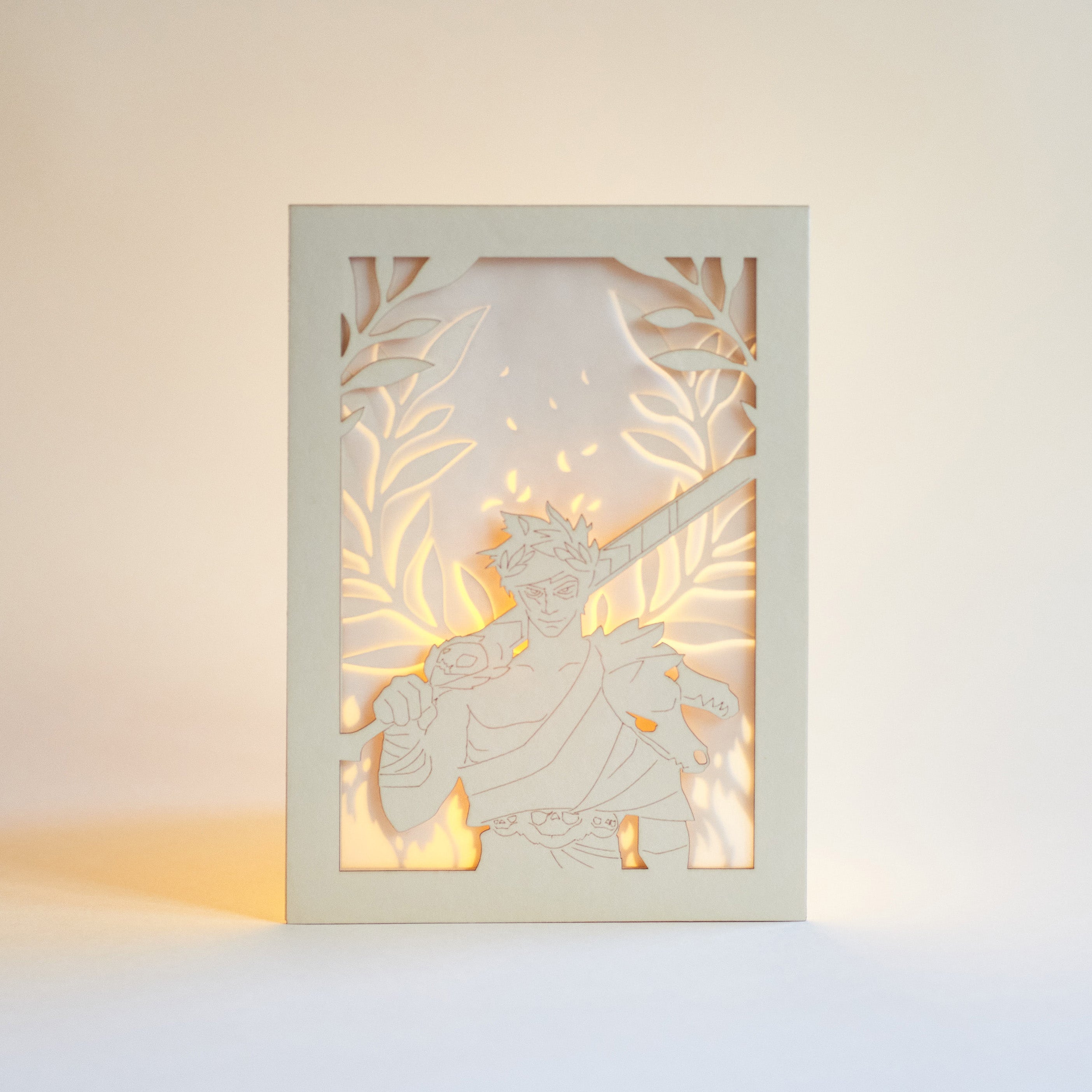 Zagreus from Hades game with sword standing in front of olive branches and flames