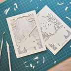 Zagreus from Hades game with sword standing in front of olive branches and flames