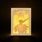 Zagreus from Hades game with sword standing in front of olive branches and flames