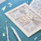 Realistic bee with delicate wings and honeycomb background