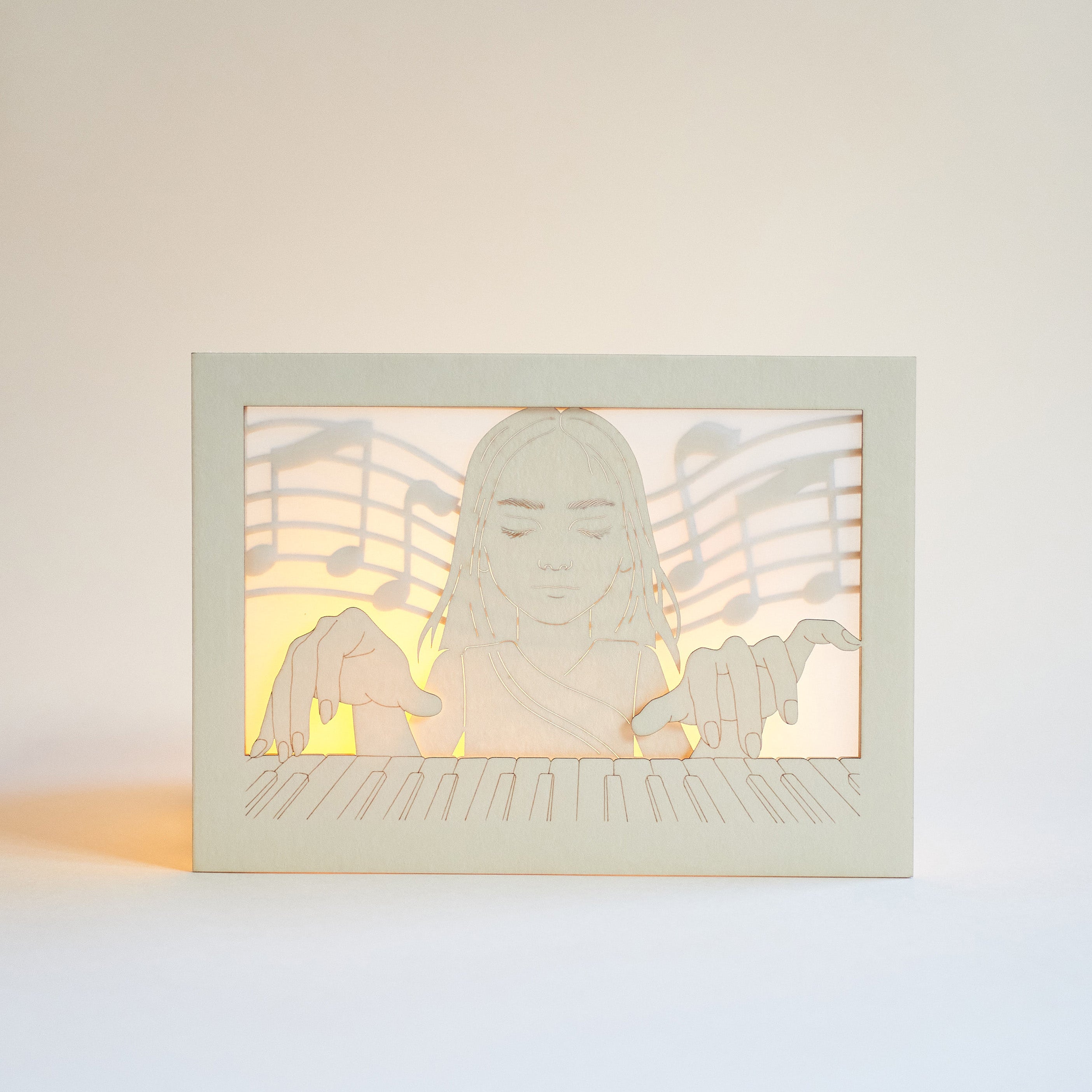 Young woman pianist with closed eyes playing piano with musical notes