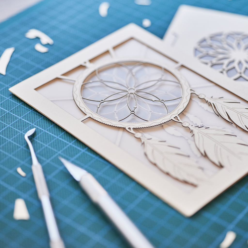 Dreamcatcher with beads feathers and intricate woven pattern