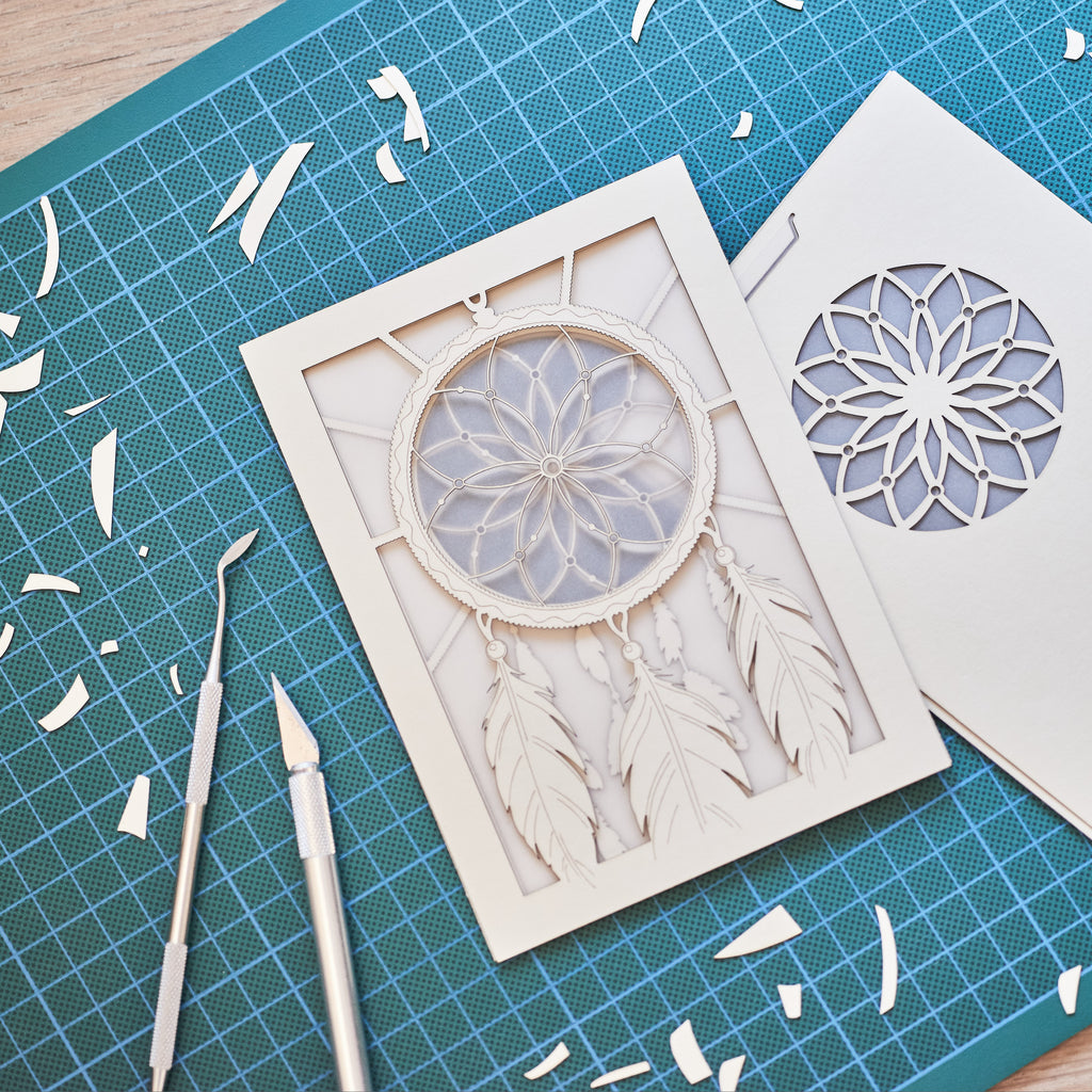 Dreamcatcher with beads feathers and intricate woven pattern