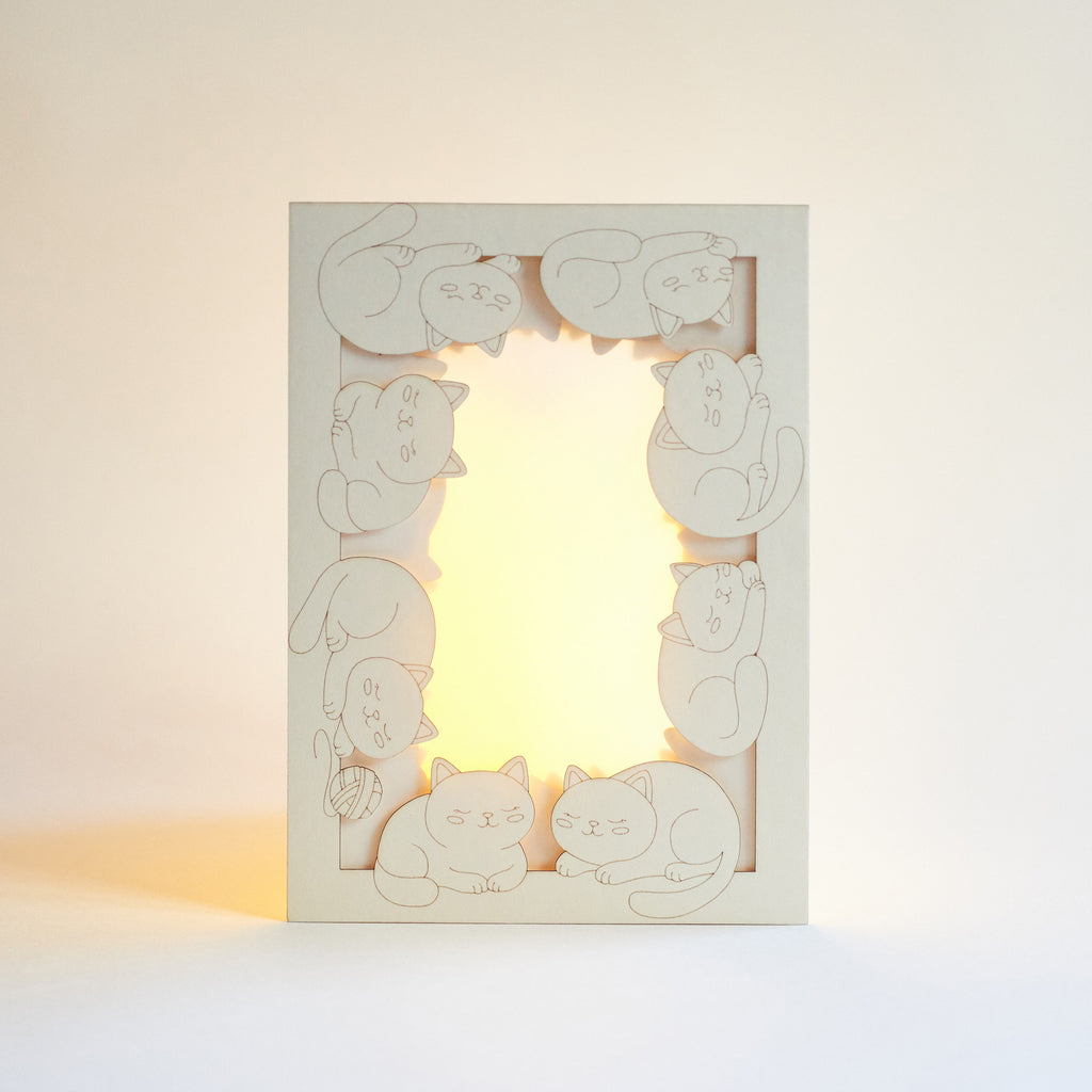 Adorable sleeping cats and kittens filling entire frame