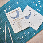 Little boy astronaut climbing ladder to moon and stars