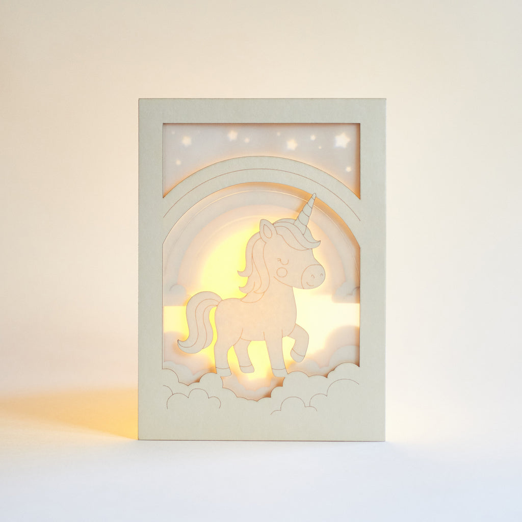 Chubby unicorn dancing under rainbow in clouds with stars