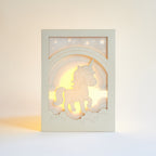 Chubby unicorn dancing under rainbow in clouds with stars