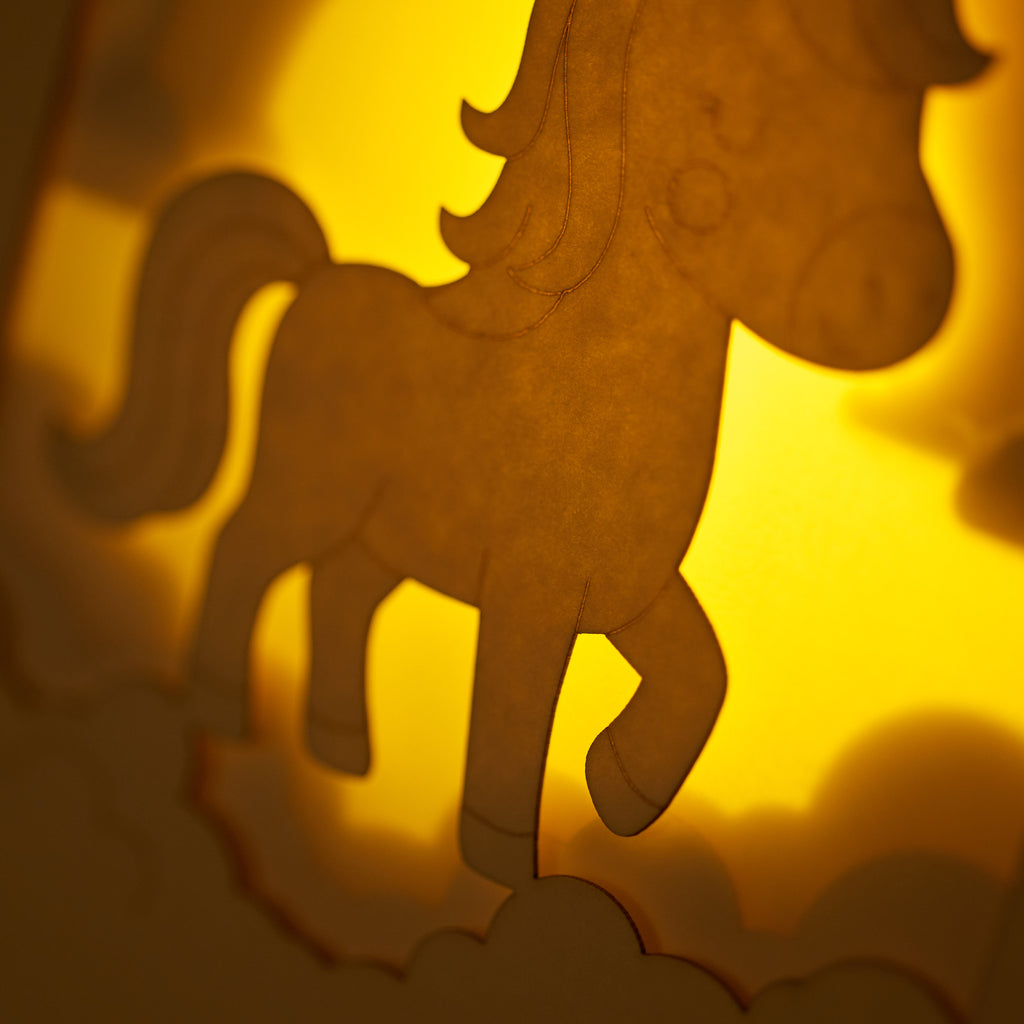 Chubby unicorn dancing under rainbow in clouds with stars