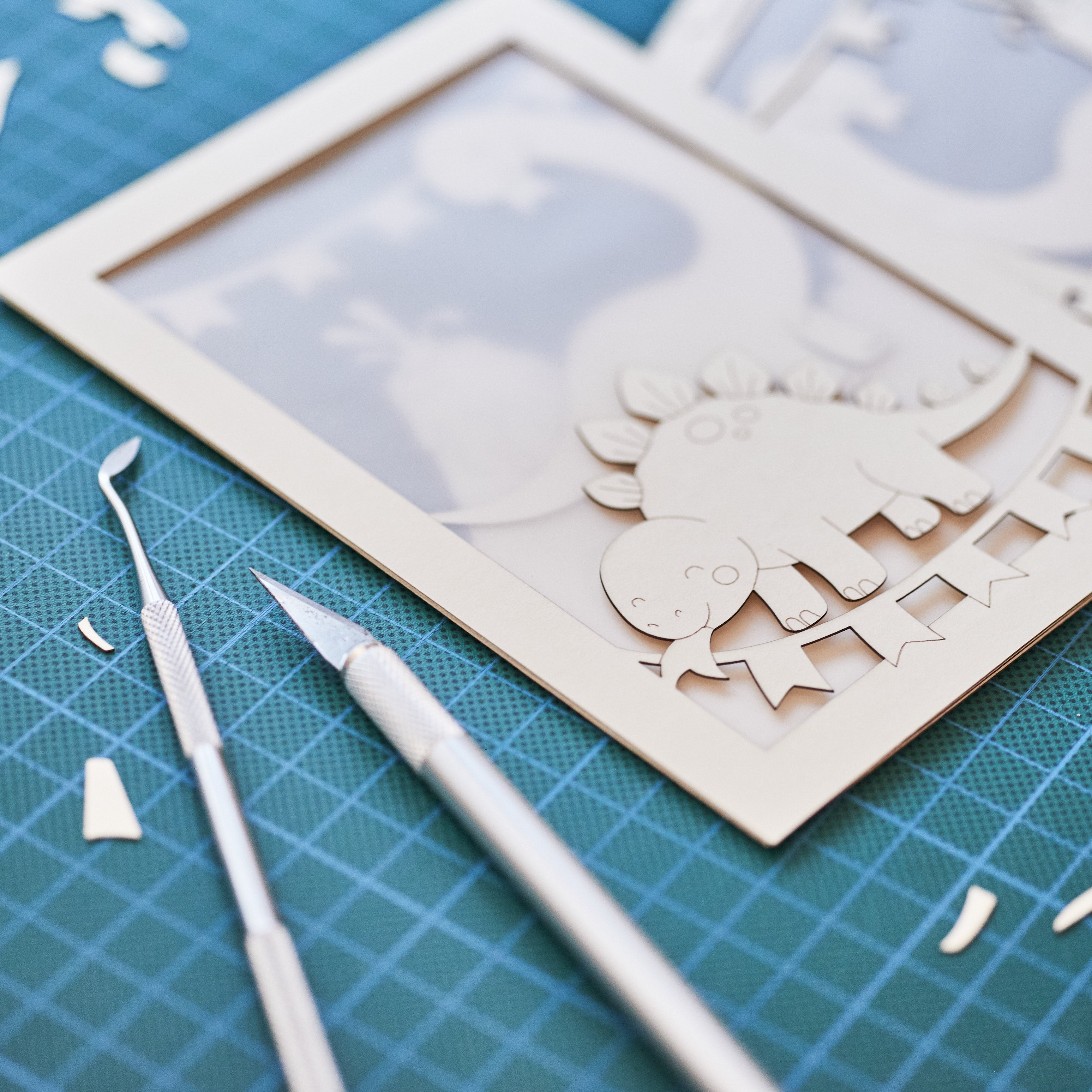 Adorable dinosaurs diplodocus and stegosaurus with birthday streamers and volcano