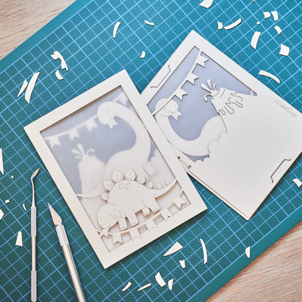 Adorable dinosaurs diplodocus and stegosaurus with birthday streamers and volcano