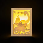 Adorable dinosaurs diplodocus and stegosaurus with birthday streamers and volcano