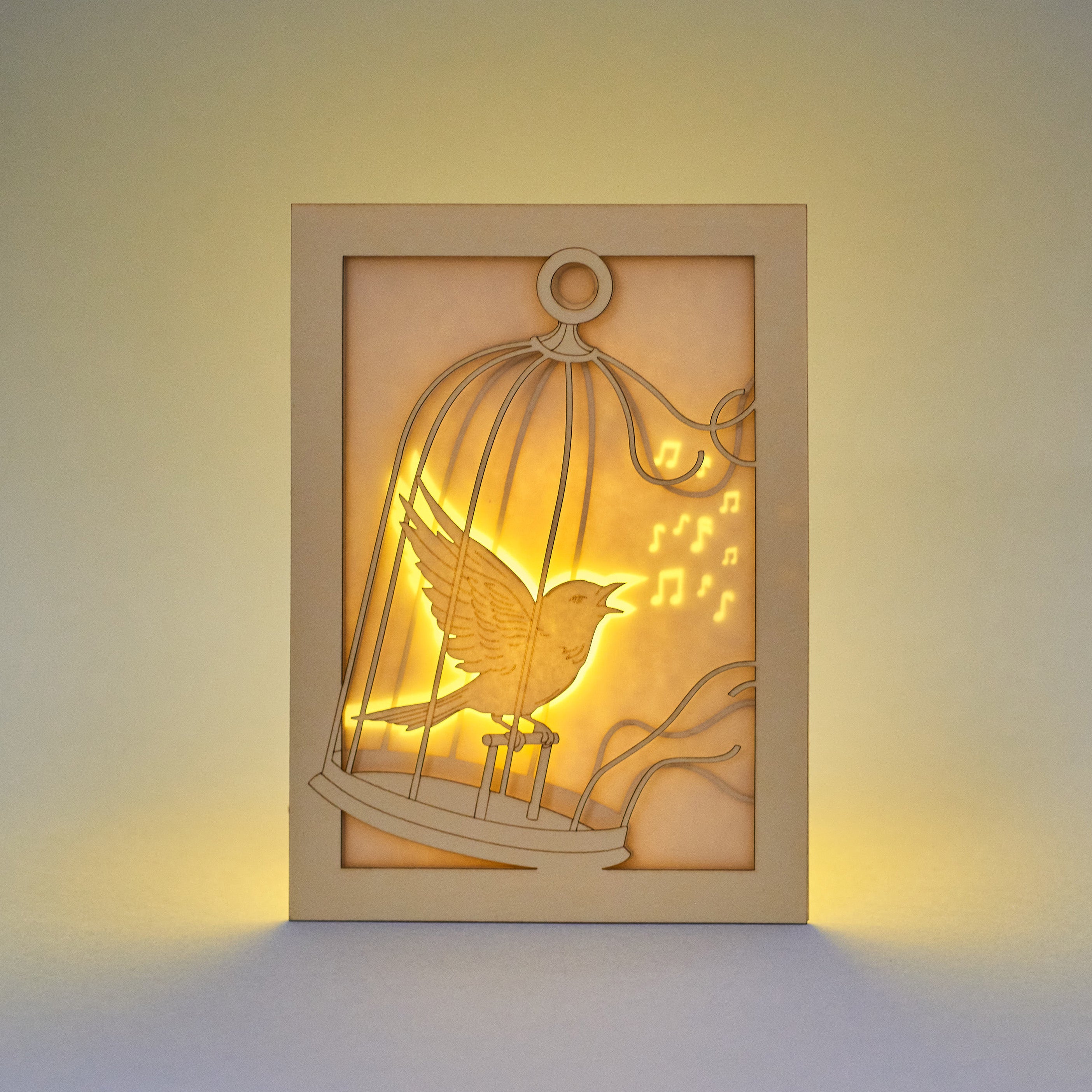 Bird escaping golden cage through song with broken bars