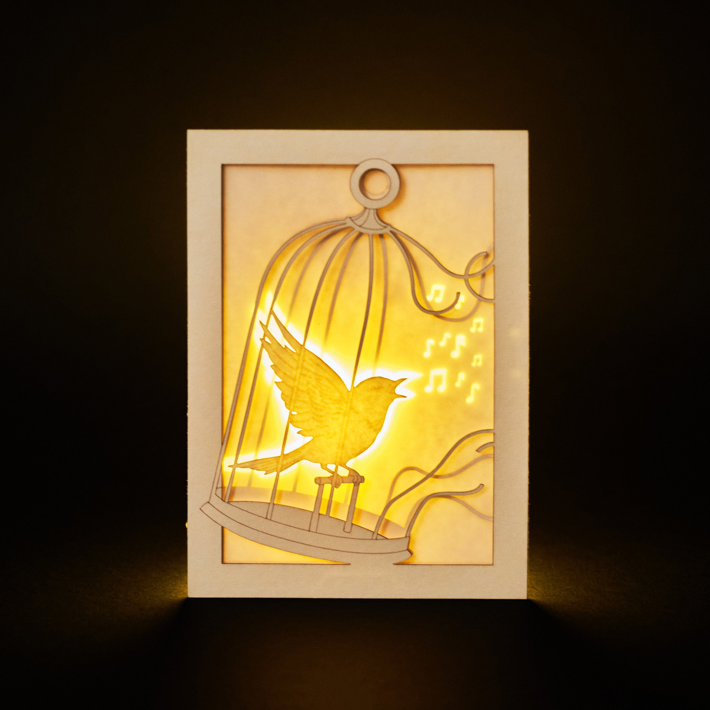 Bird escaping golden cage through song with broken bars