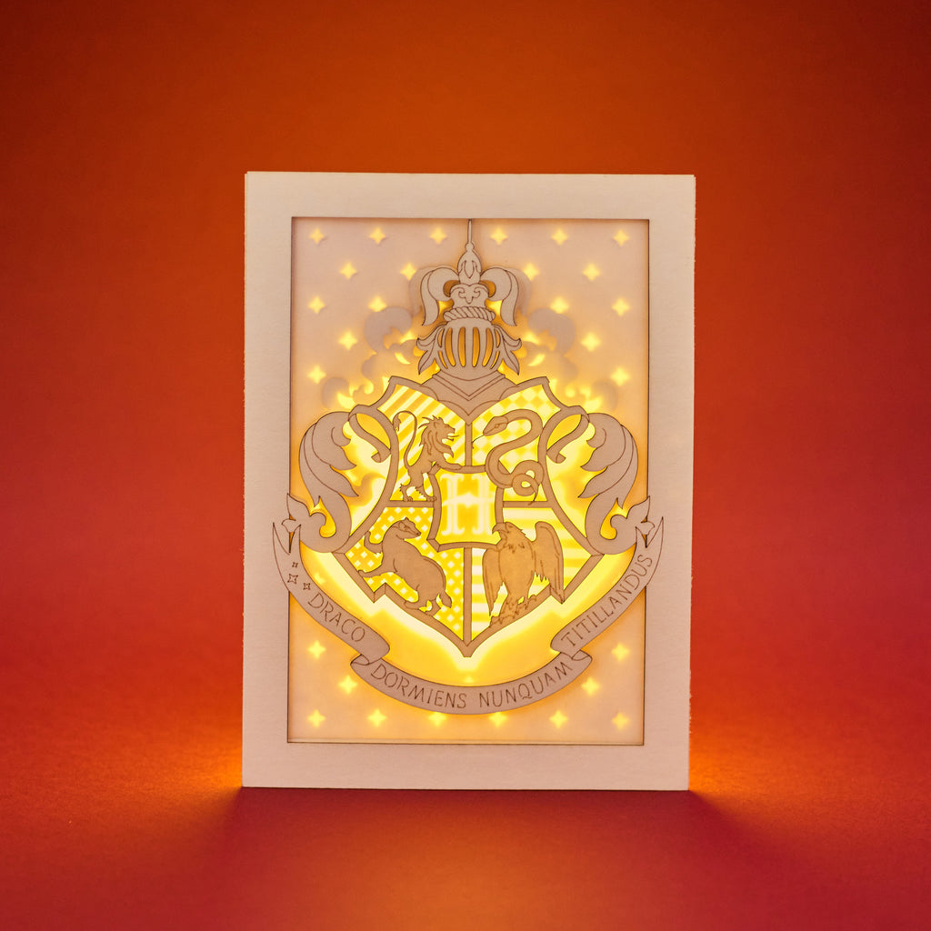 Hogwarts crest with magical details across three layers