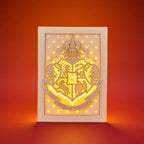 Hogwarts crest with magical details across three layers