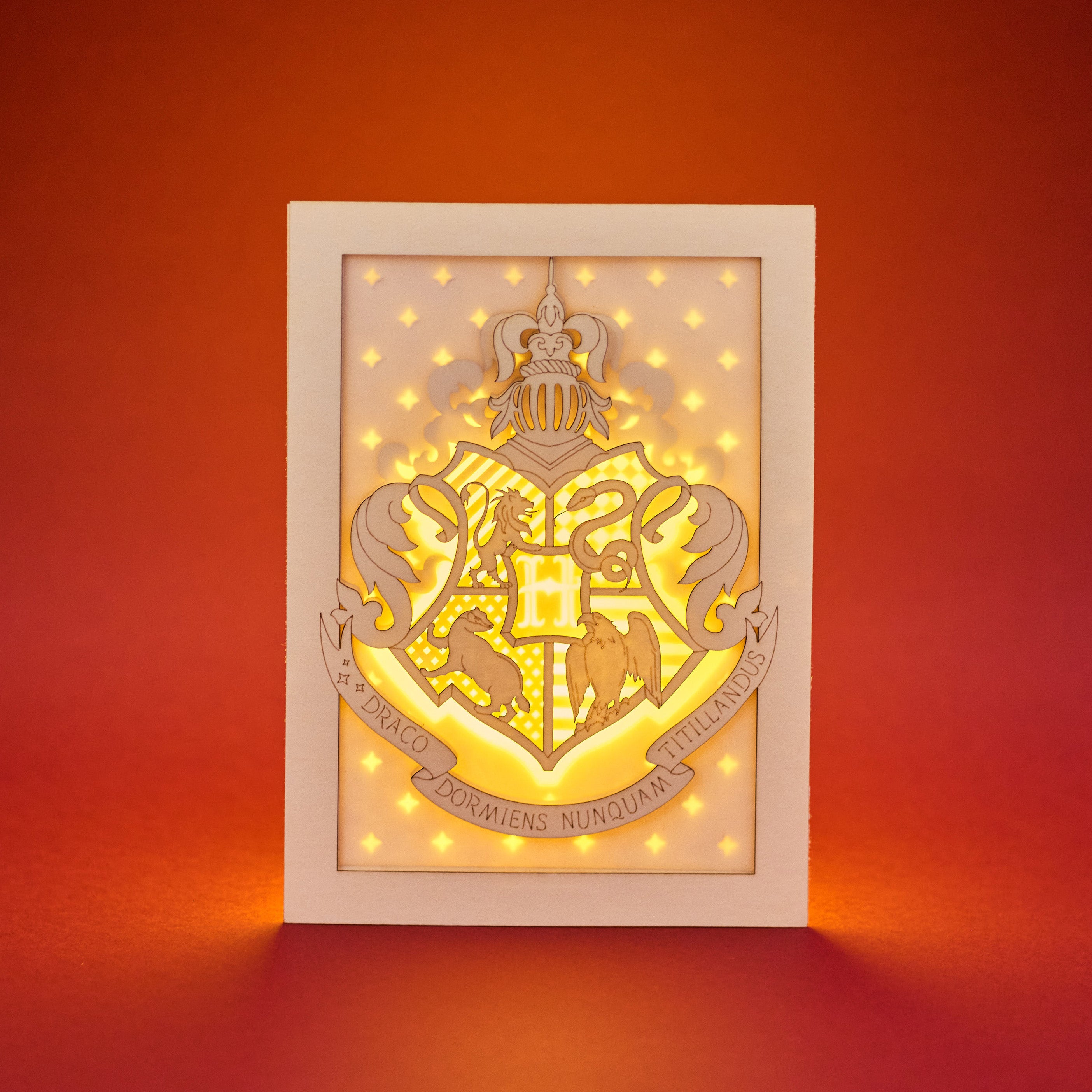 Hogwarts crest with magical details across three layers