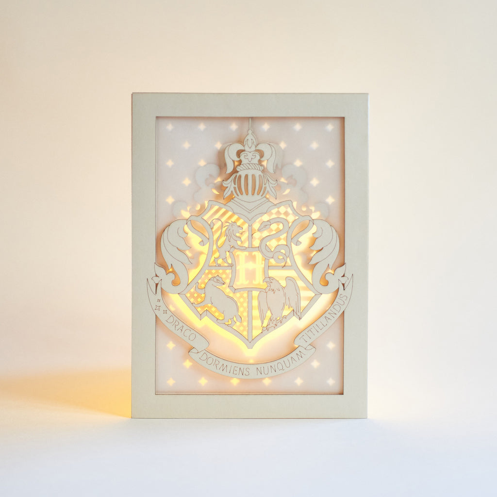 Hogwarts crest with magical details across three layers