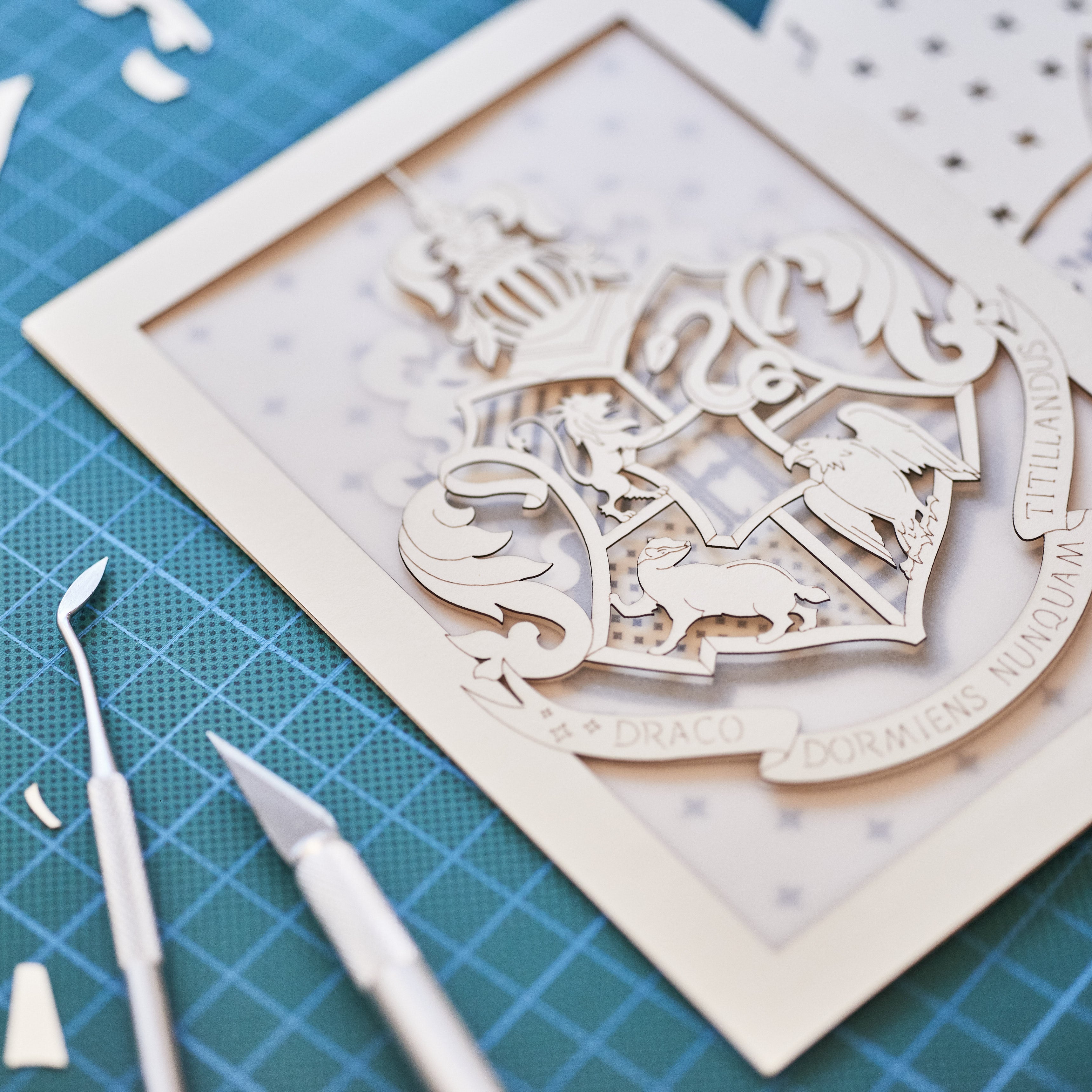 Hogwarts crest with magical details across three layers