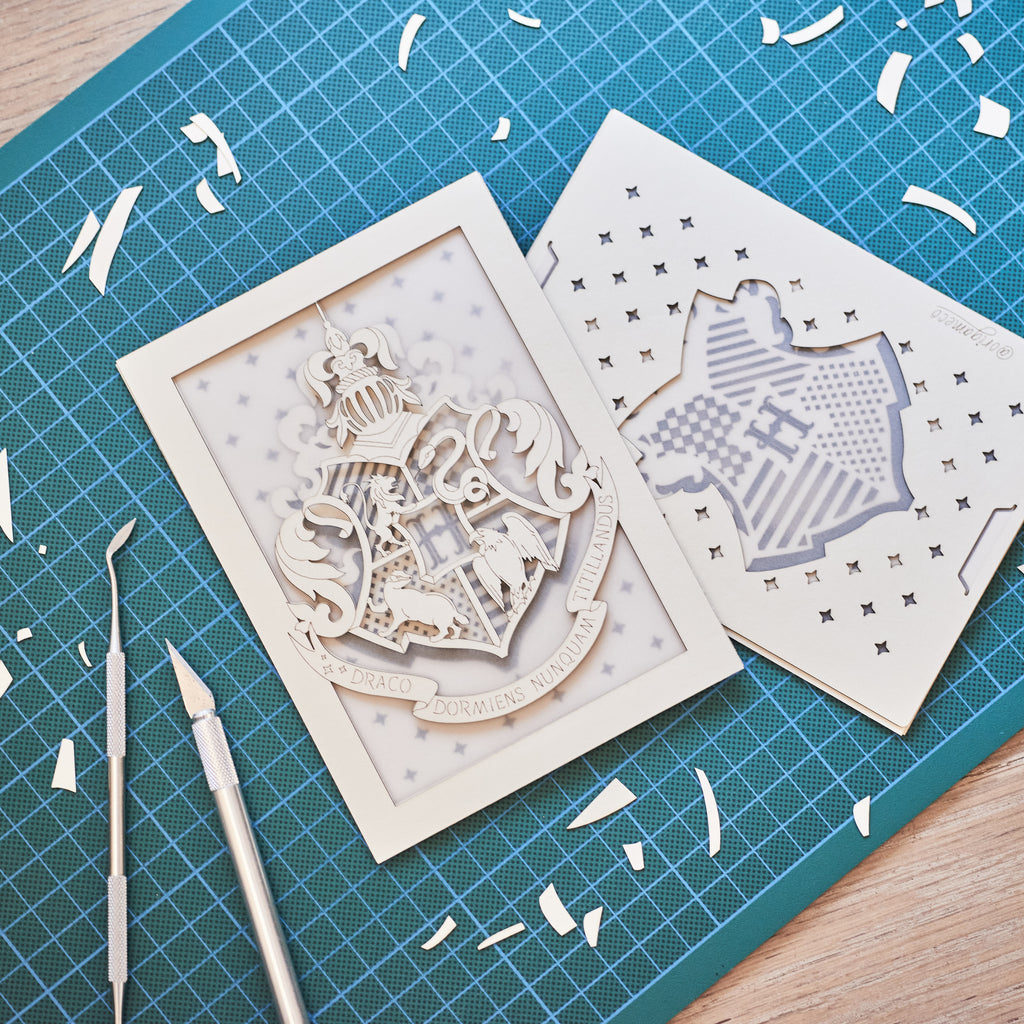 Hogwarts crest with magical details across three layers