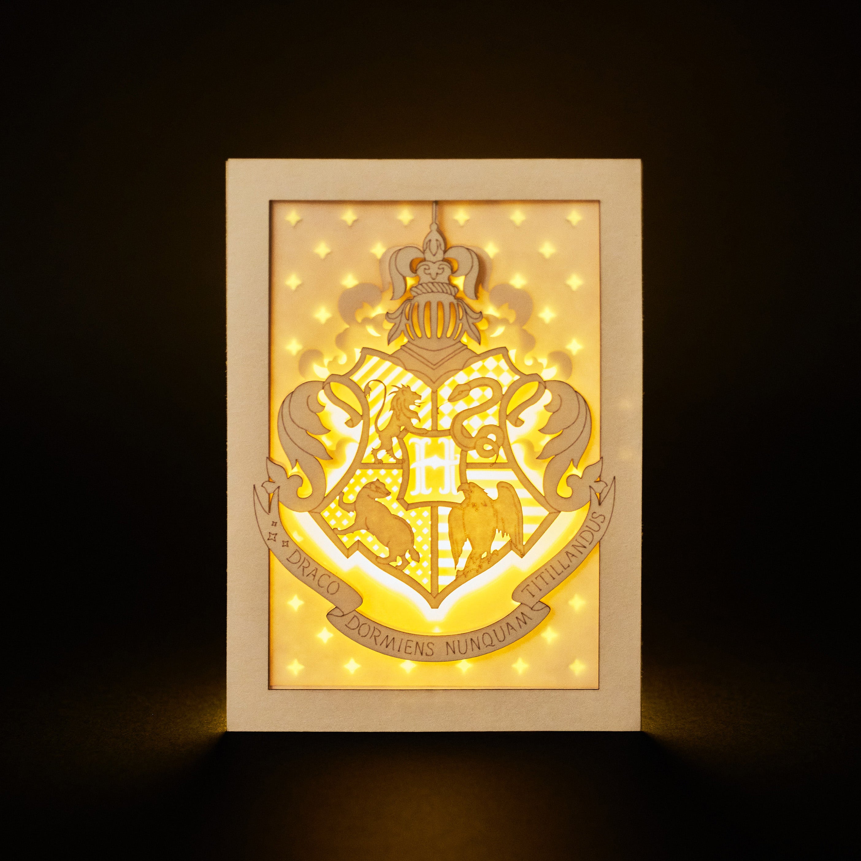 Hogwarts crest with magical details across three layers