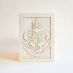 Hogwarts crest with magical details across three layers