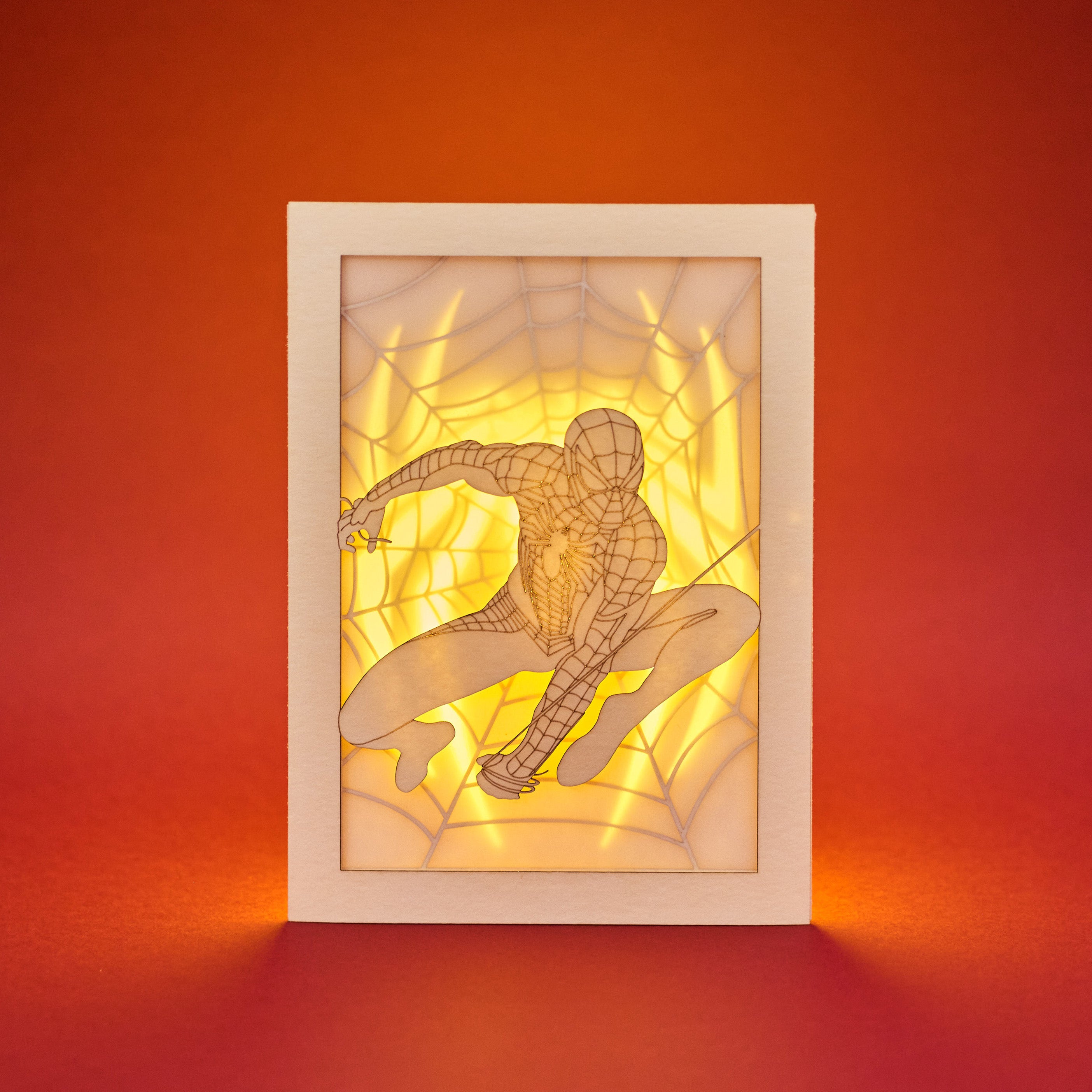 Spider-Man swinging on web with logo and intricate web design