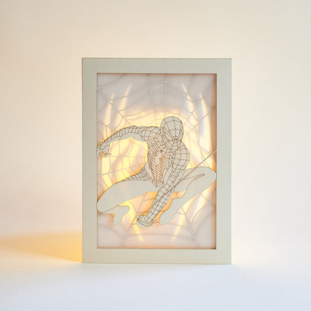 Spider-Man swinging on web with logo and intricate web design