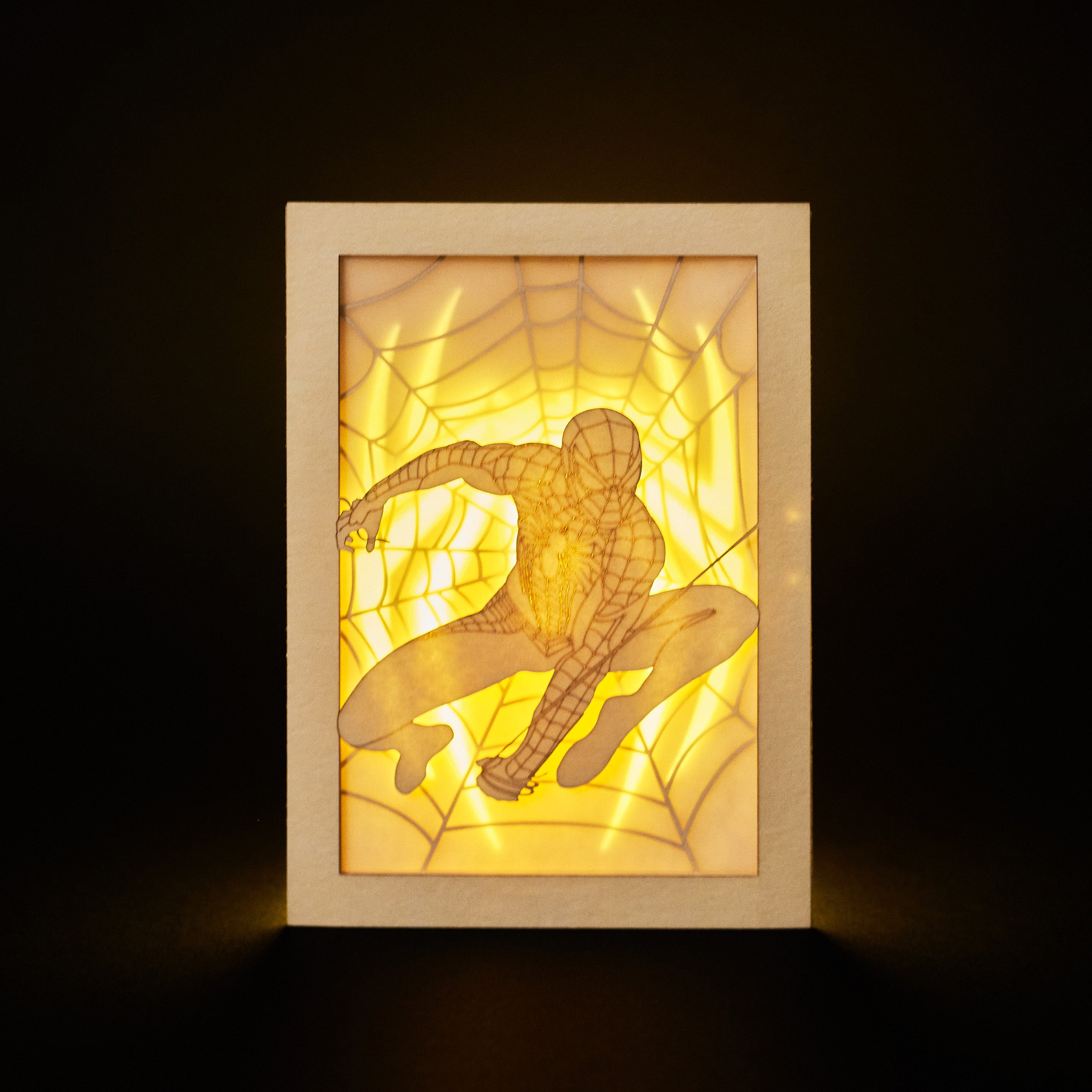 Spider-Man swinging on web with logo and intricate web design