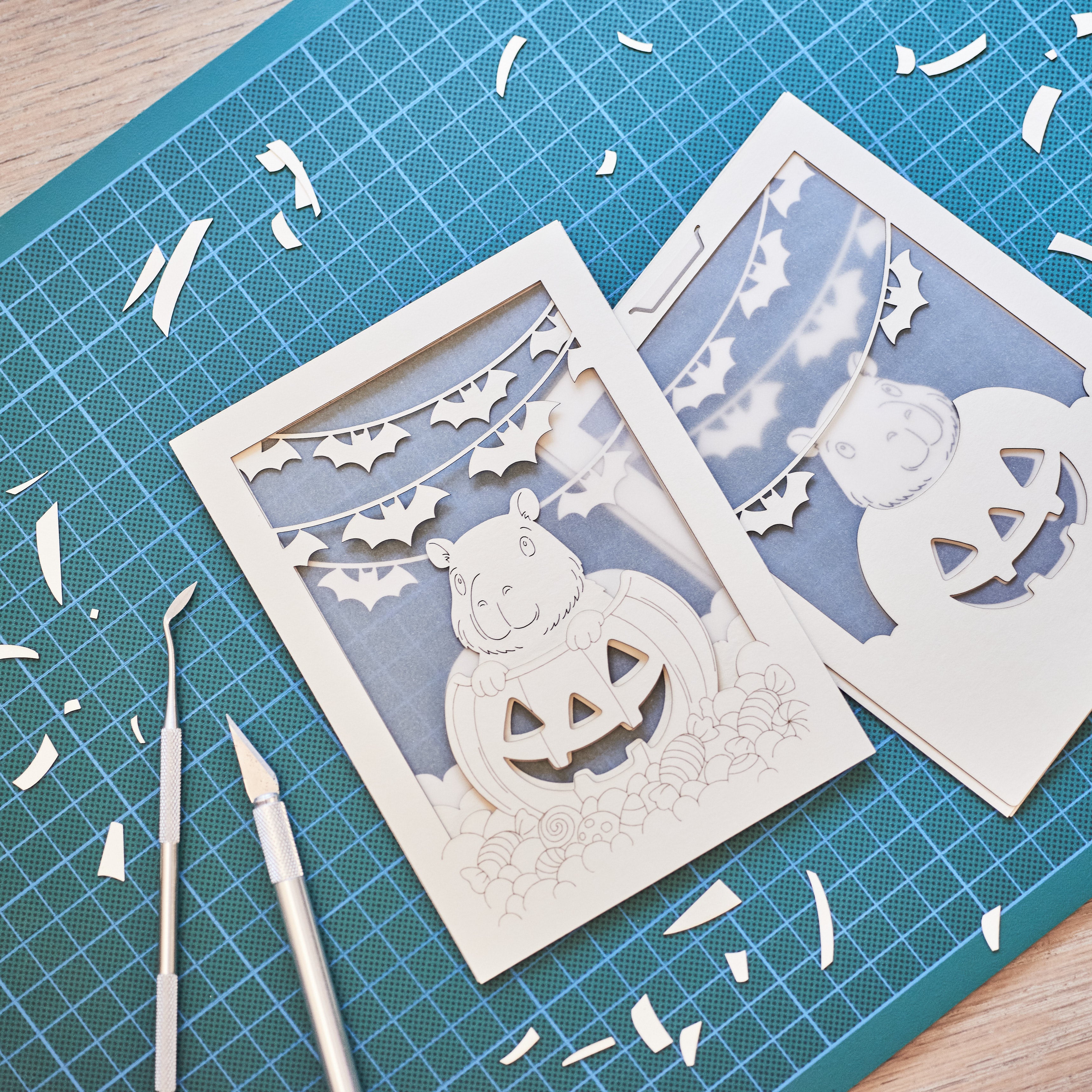 Cute capybara in jack-o-lantern with candy and bats Halloween