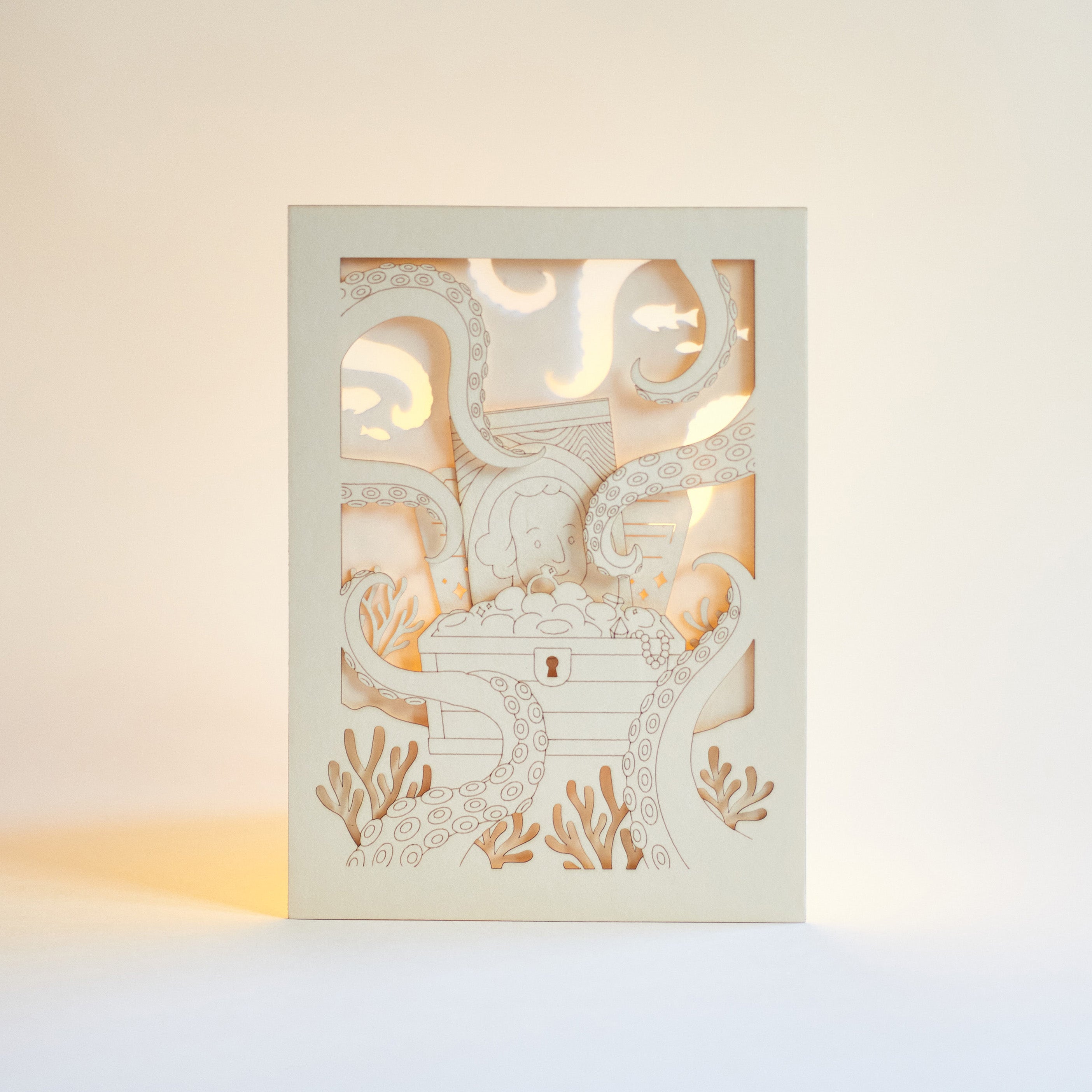 Ocean treasure chest with octopus tentacles and sea creatures