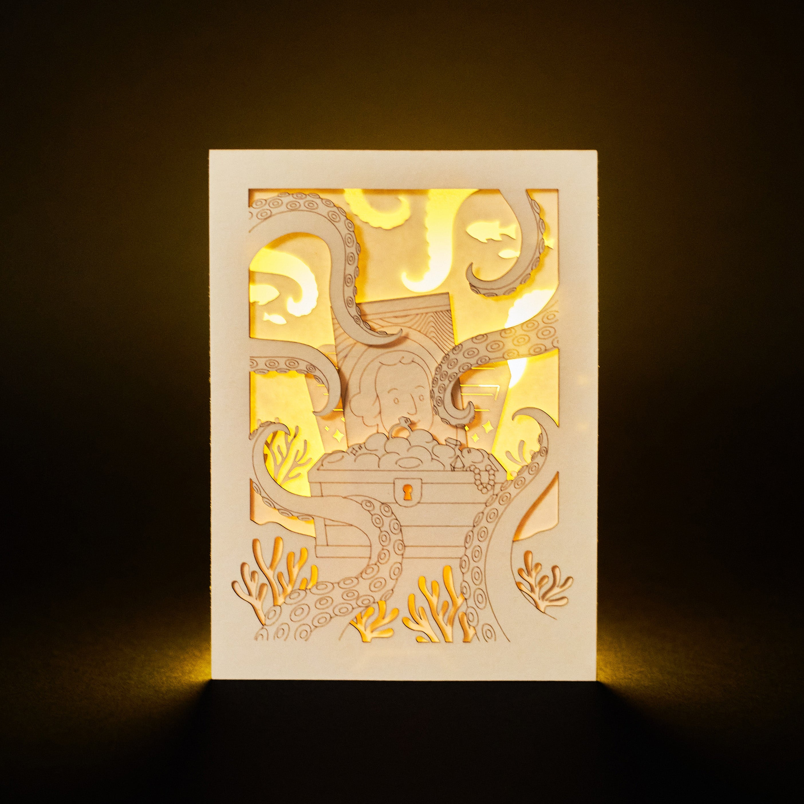 Ocean treasure chest with octopus tentacles and sea creatures