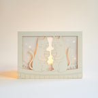 Two cats drinking wine on rooftop under moon with city view