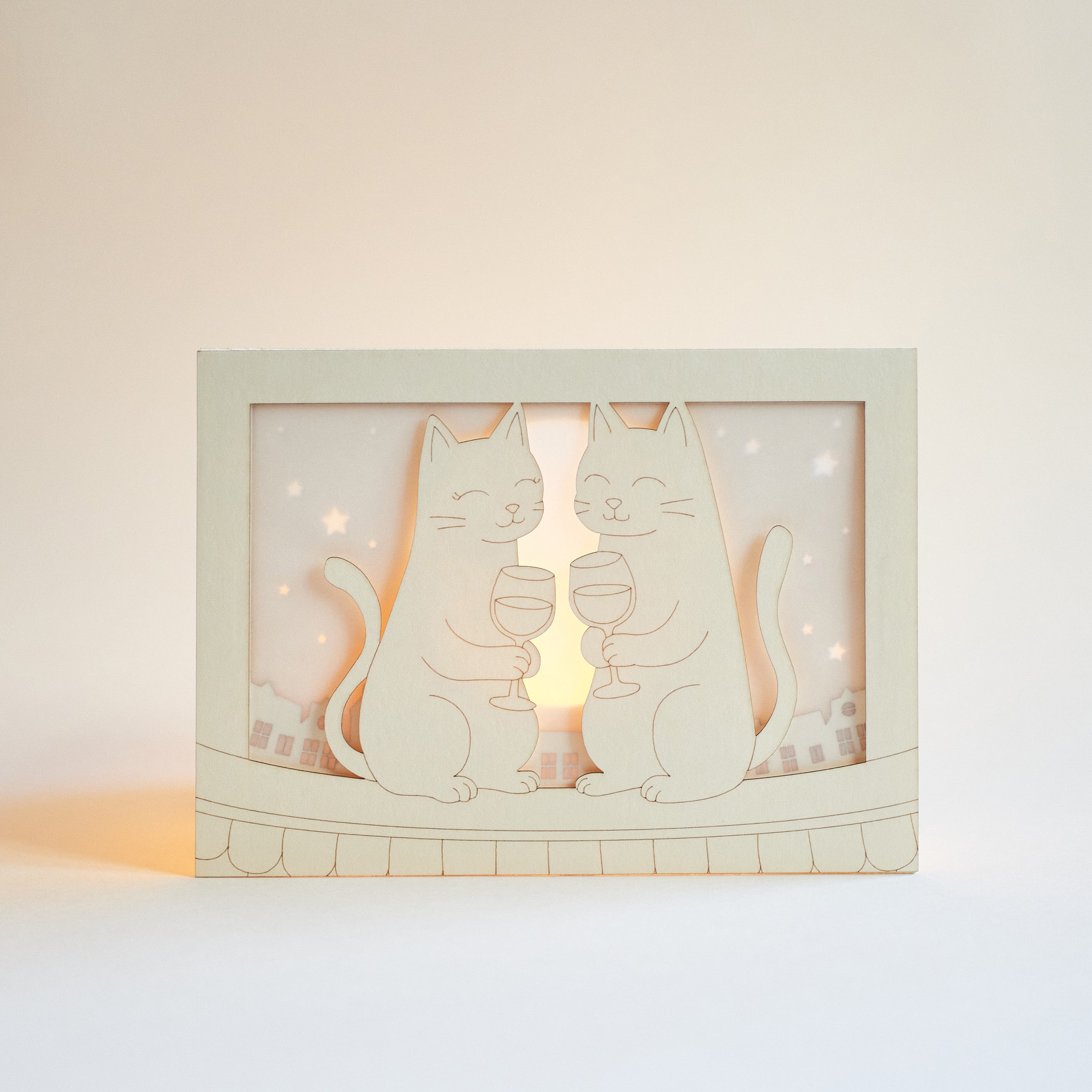 Two cats drinking wine on rooftop under moon with city view