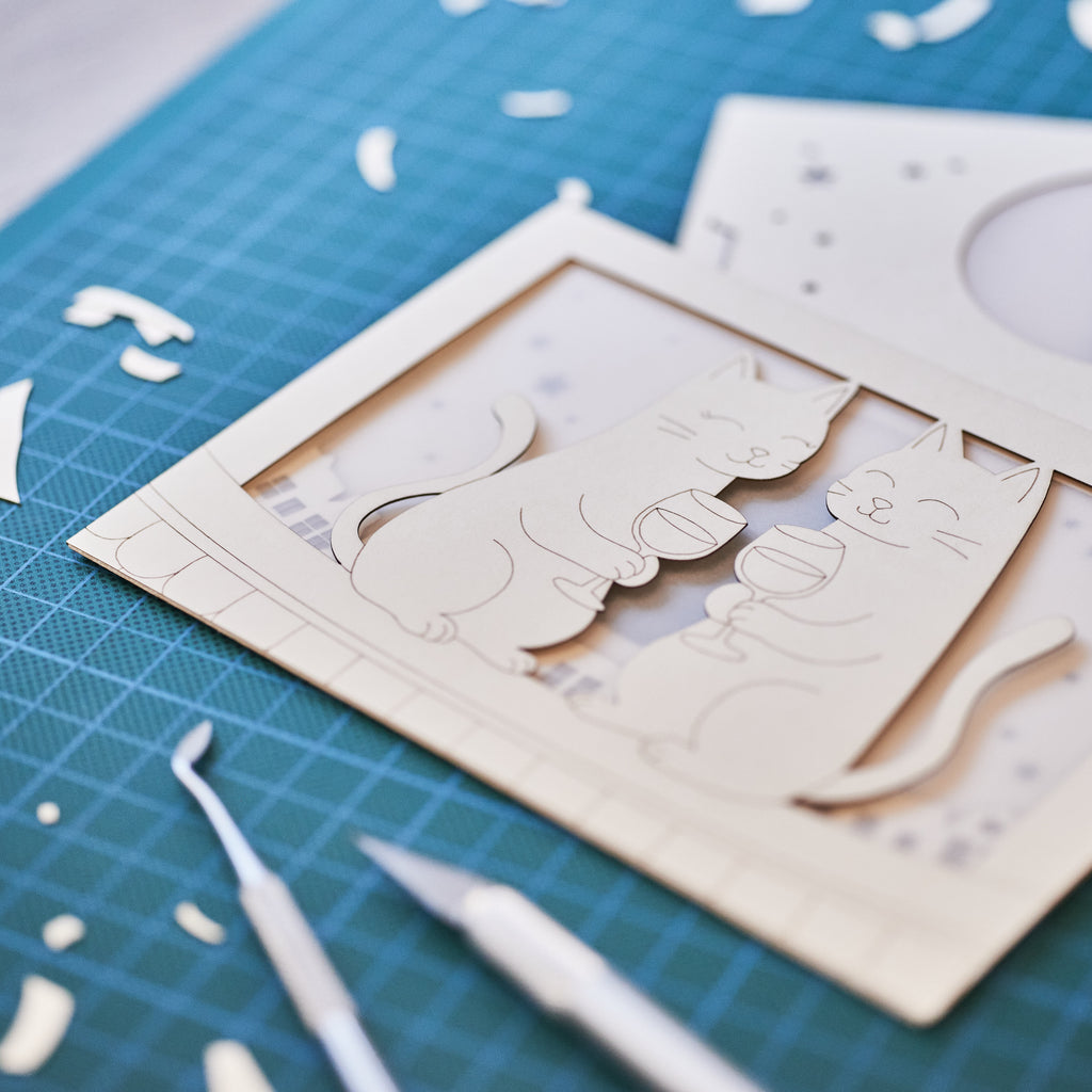 Two cats drinking wine on rooftop under moon with city view