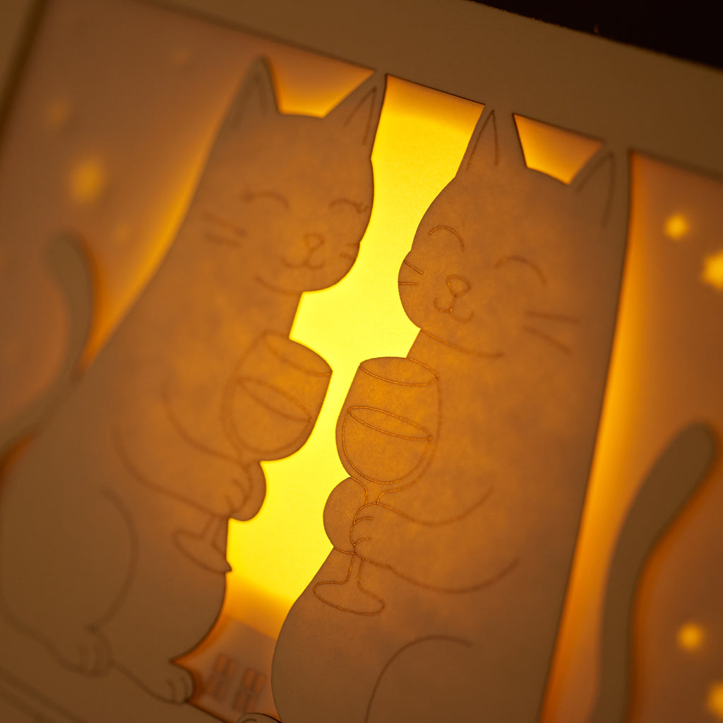 Two cats drinking wine on rooftop under moon with city view