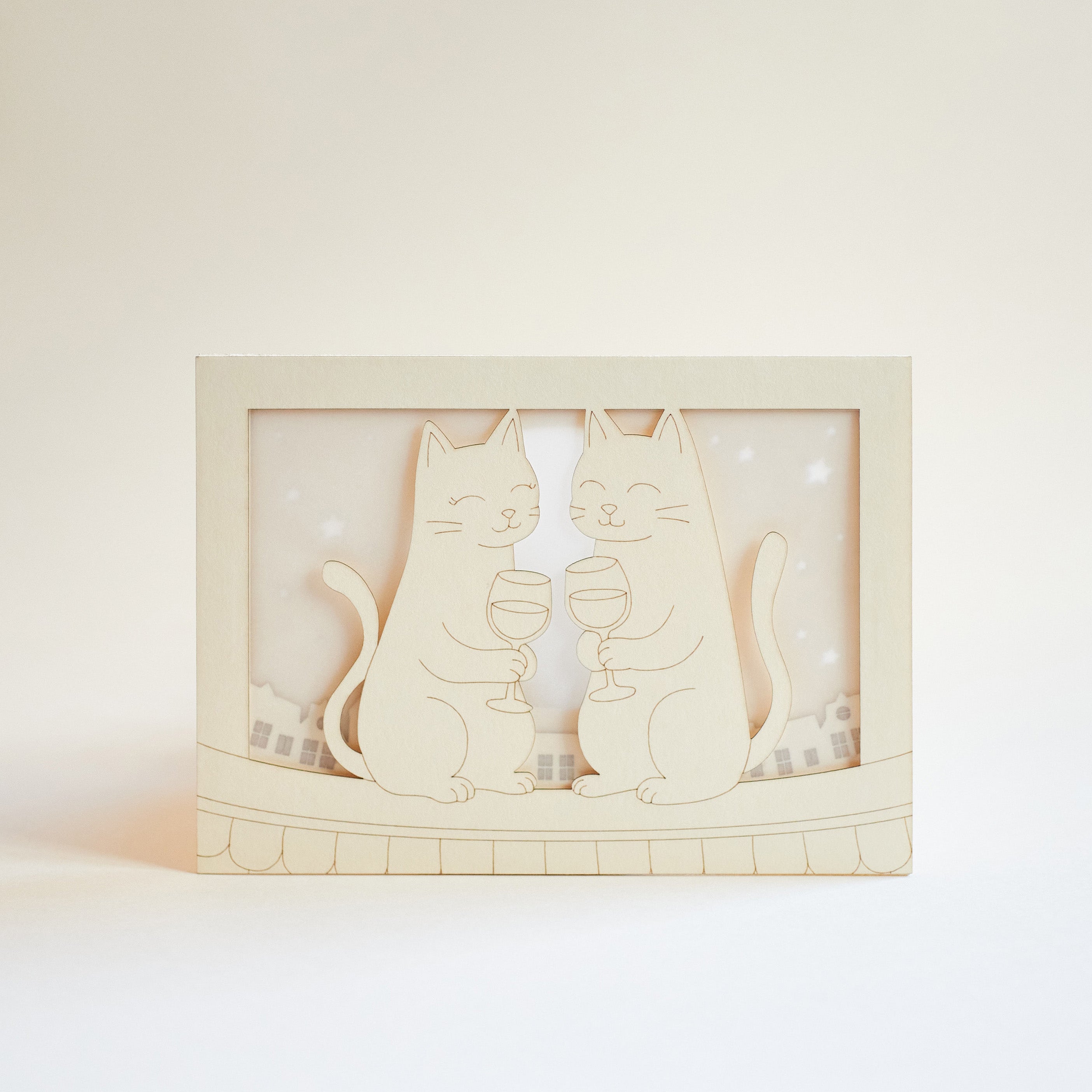 Two cats drinking wine on rooftop under moon with city view