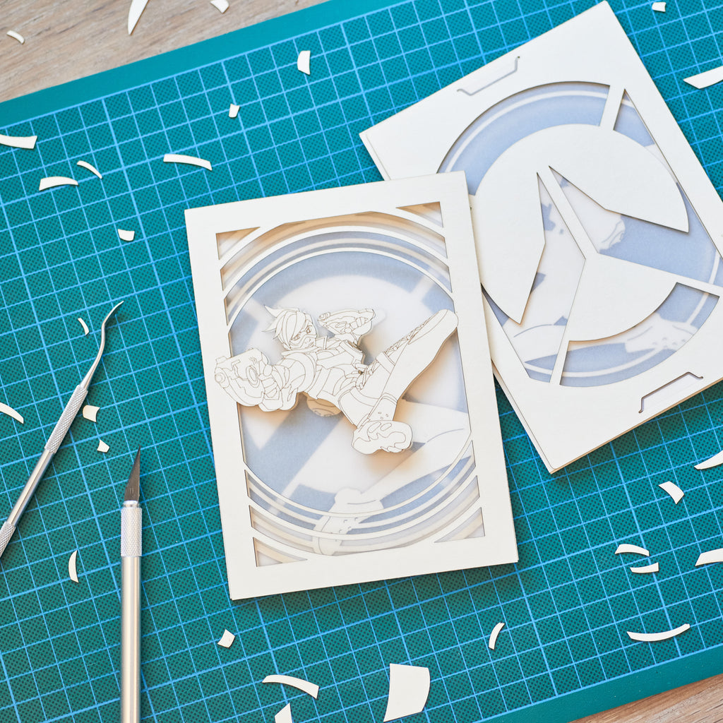 Overwatch Tracer Card: Lena Oxton over Glowing Logo Background