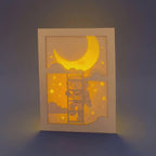 Little boy astronaut climbing ladder to moon and stars