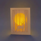 Graceful deer silhouette in winter forest with moon