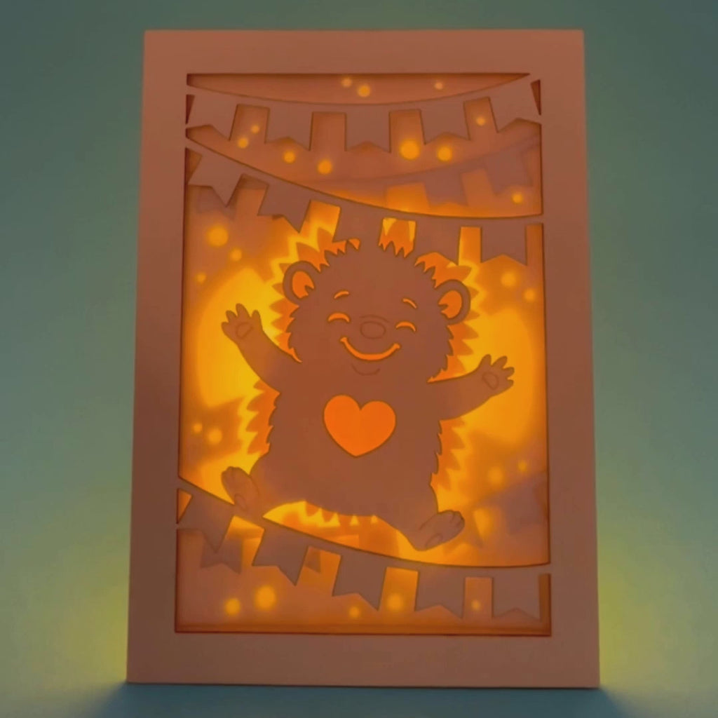 Cute hedgehog making snow angel with festive banner flags