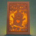 Cute hedgehog making snow angel with festive banner flags