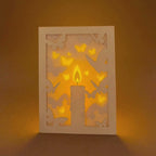 Burning candle with butterflies and moths drawn to flame