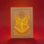 Hogwarts crest with magical details across three layers